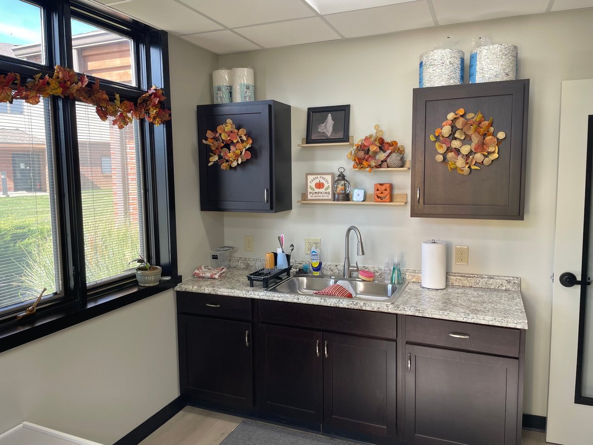 Dark cabinetry, granite countertop and sink in the teaching kitchen at New Heights Therapy in Topeka, Kansas — where children build independence and food-prep skills during pediatric occupational therapy