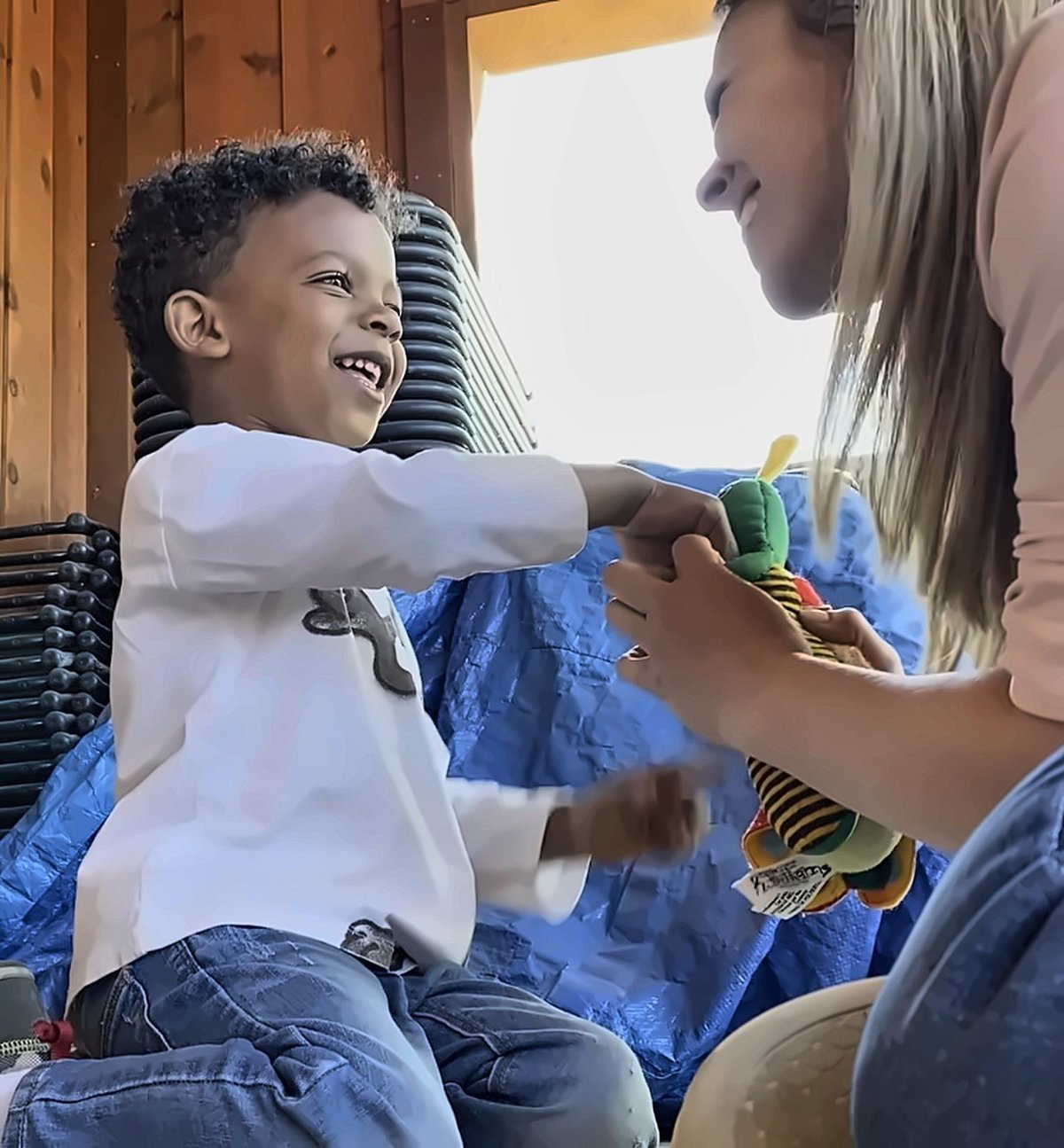 Kimberly Williams, founder of New Heights Therapy, playing with a young child during a speech therapy session